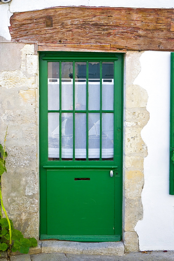 Door with net panel, Ile De Re, France.