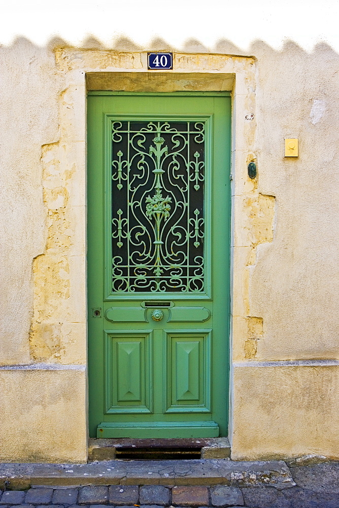 Traditional door with metal design, Ile De Re, France.