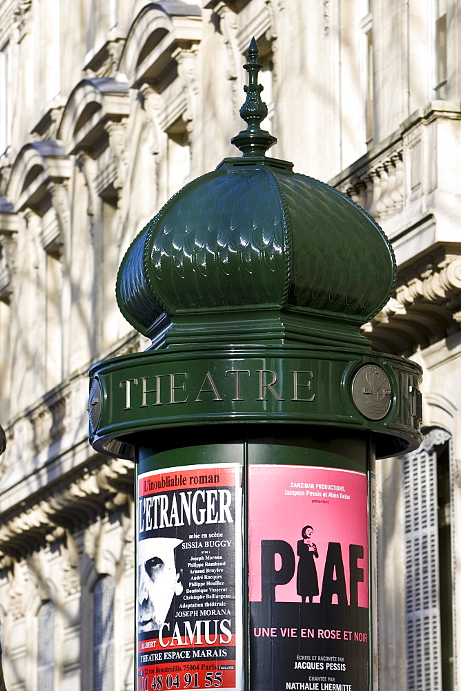 Obelisk advertising theatre productions of Edith Piaf and Camus in Parisian street, France