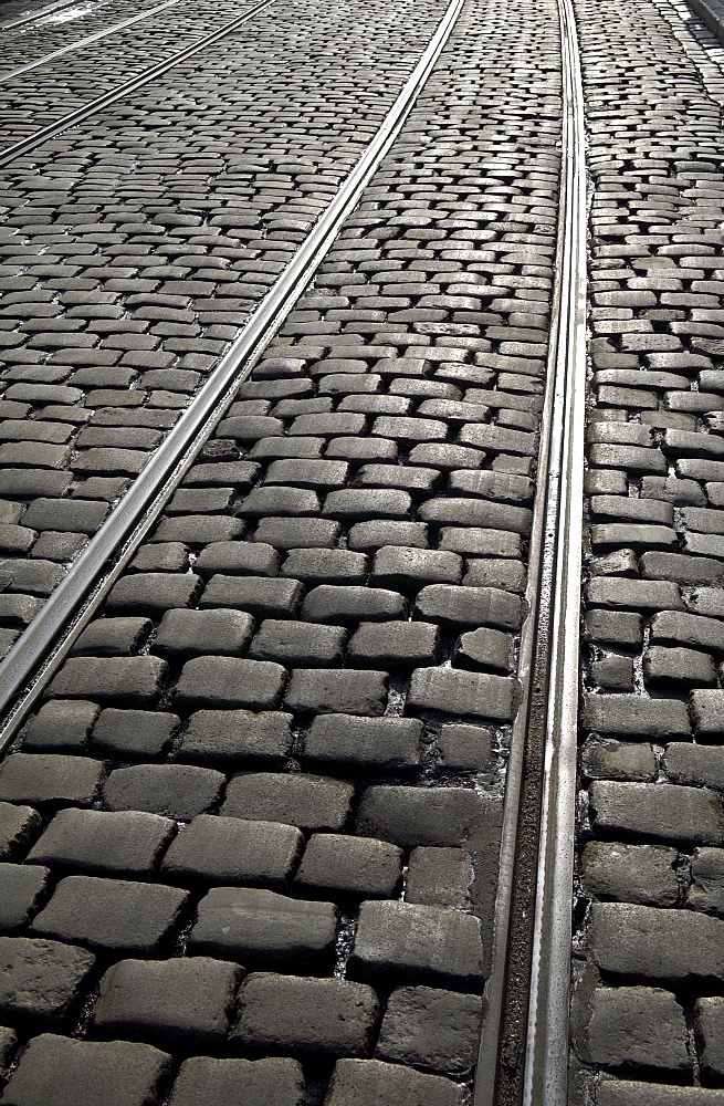 Tram tracks in cobbled street  in Korenmarkt, Ghent, Belgium