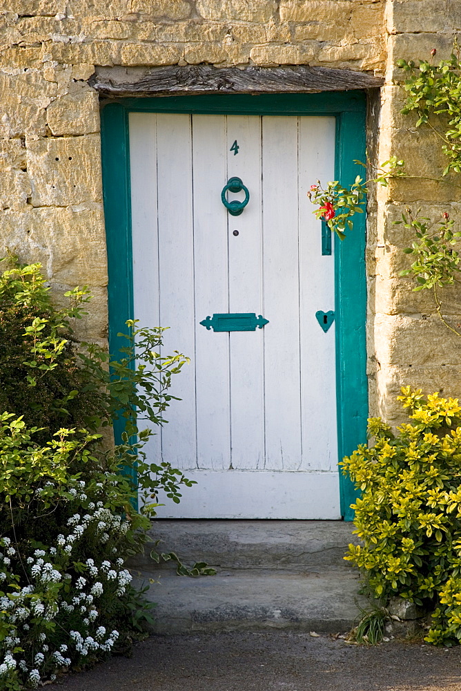 Traditional cottage front door and doorway, Stanton village, The Cotswolds, Gloucestershire, United Kingdom