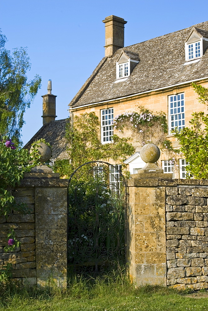 Grand house period property with dry stone wall near Winchcombe, Gloucestershire, The Cotswolds, England, United Kingdom