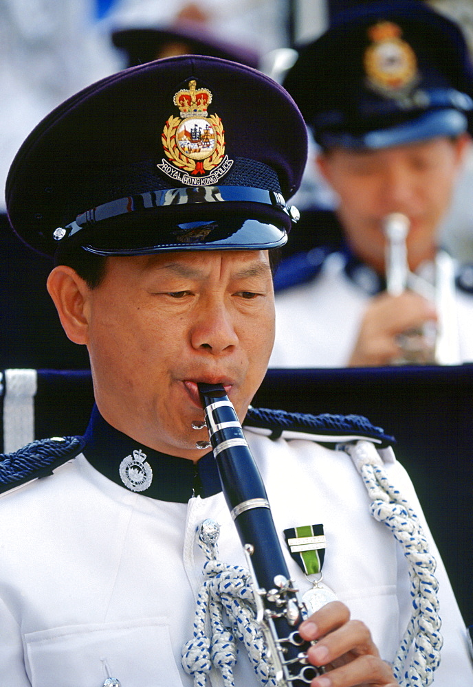 Member of the Hong Kong Police force playing clarinet for the Police band