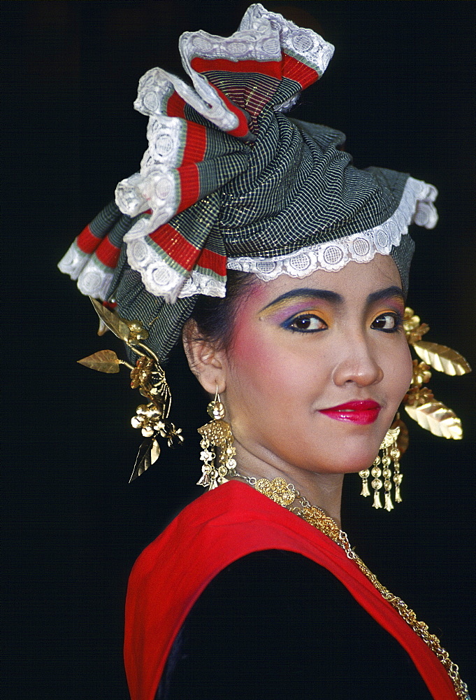 Woman wearing traditional Indonesian dress, Jakarta, Indonesia.