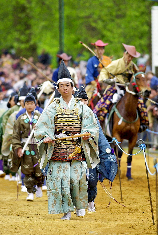 Japanese horseman and traditional dancers in costume at the japanese exhibition ' matsuri japan in the park '  in hyde park, london.