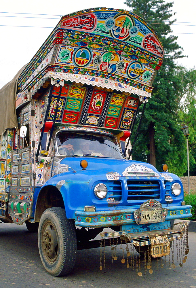 A lorry decorated with paintings and symbols in Islamabad, Pakistan