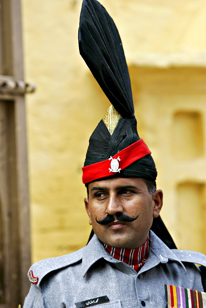 Pakistani ceremonial guard outside Sikh Temple Gurdwara of Arjan Dev, Lahore, Pakistan