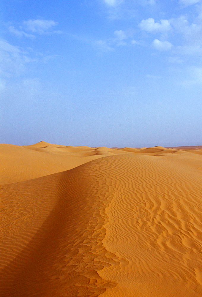 Blue sky and sand dunes in the Sahara Desert, Morocco