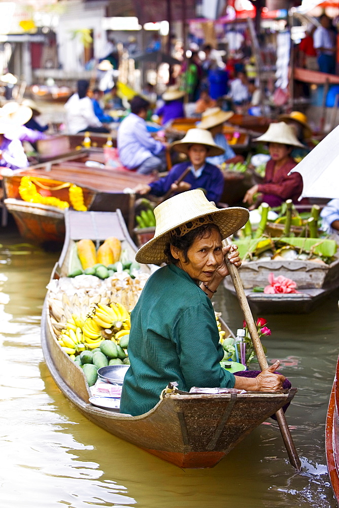 Fruit seller in the Damnern Saduak floating market, Bangkok, Thailand