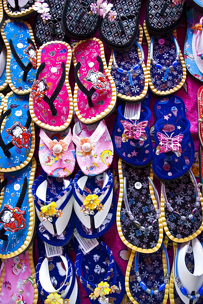 Shoes for sale in a Bangkok market, Thailand