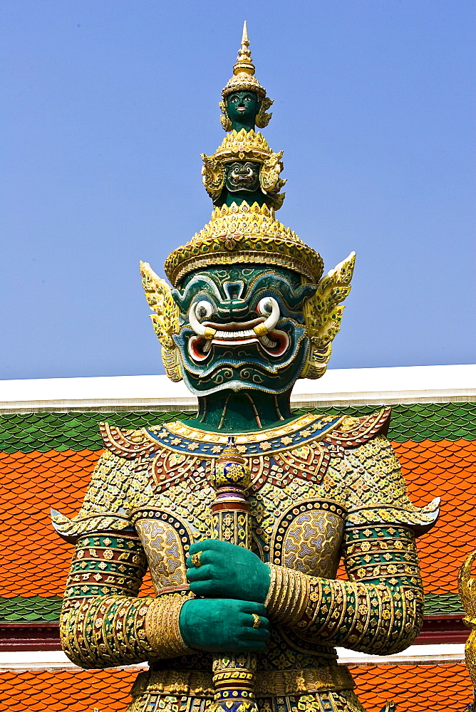 Demon Giant statue guards an entrance to The Grand Palace, Bangkok, Thailand