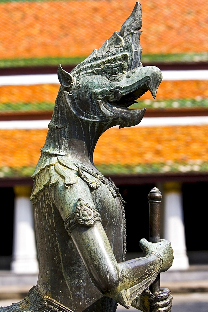 Mythical gryphon guards The Grand Palace and Temple complex, Bangkok, Thailand