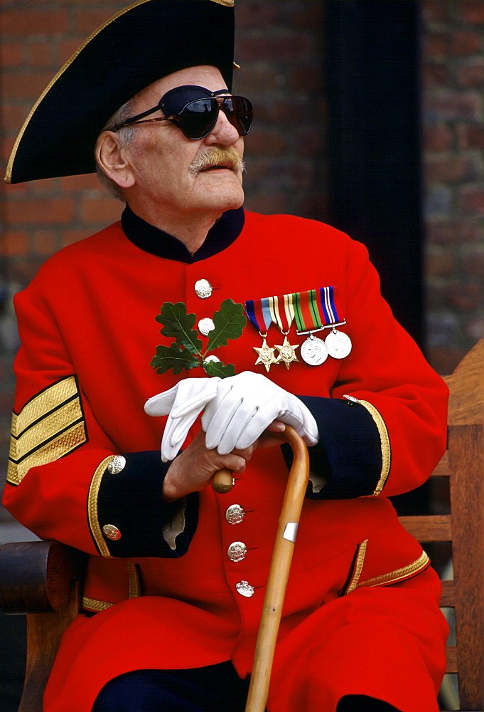 Chelsea Pensioner in red coat and tricorn hat on Founder's Day Parade at Royal Hospital, Chelsea, London, UK.