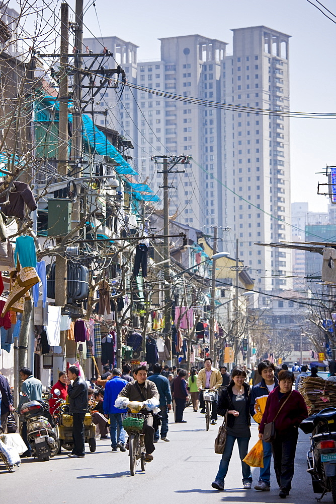 Busy street scene in Zi Zhong Road, old French Quarter in Shanghai, China