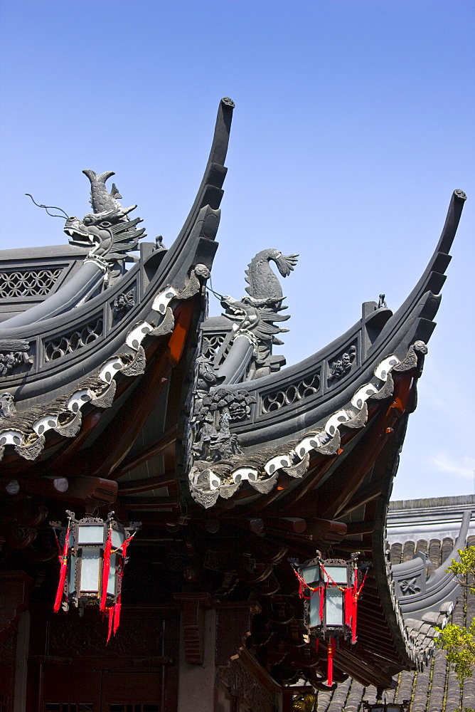 Chinese lanterns hanging from the Happiness Tower roofs, in the Yu Gardens, Shanghai, China