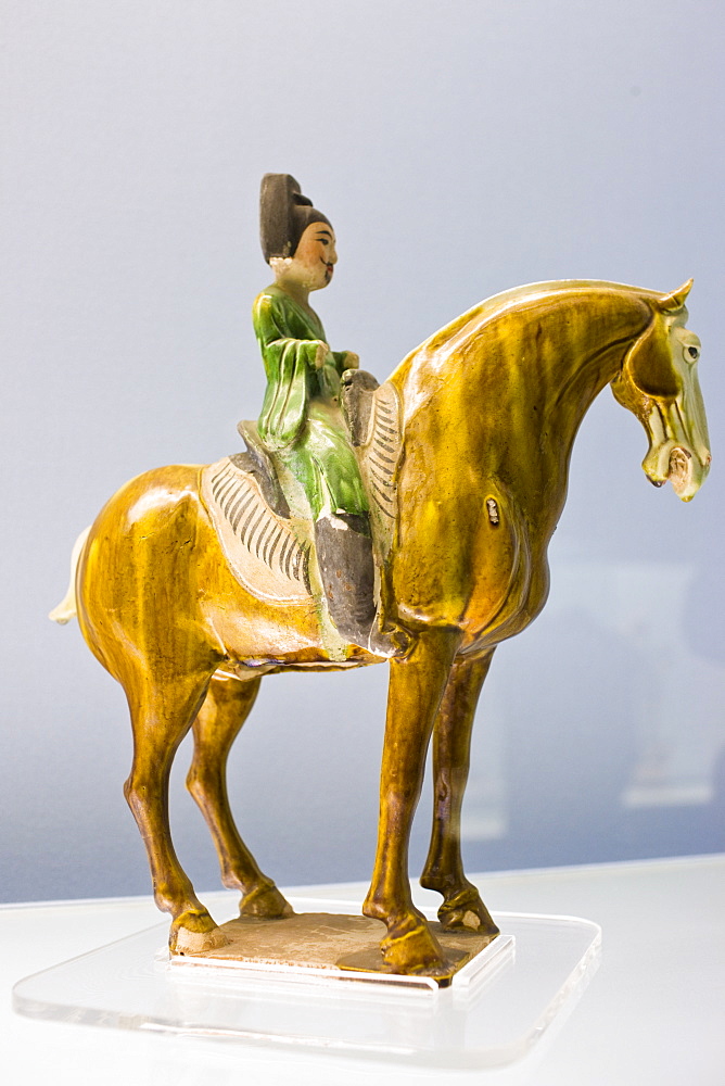 Sancai pottery figure on horseback on display in the Shanghai Museum, China