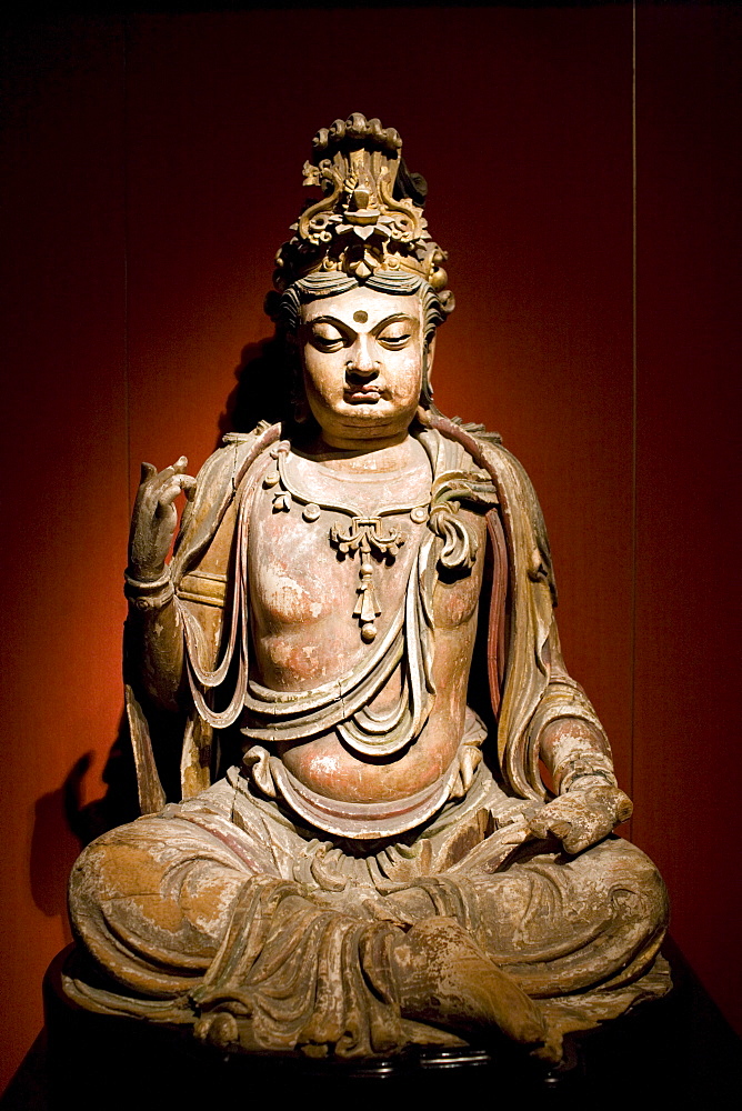 Stone Buddha figure of Bodhisattva on display in the Shanghai Museum, China