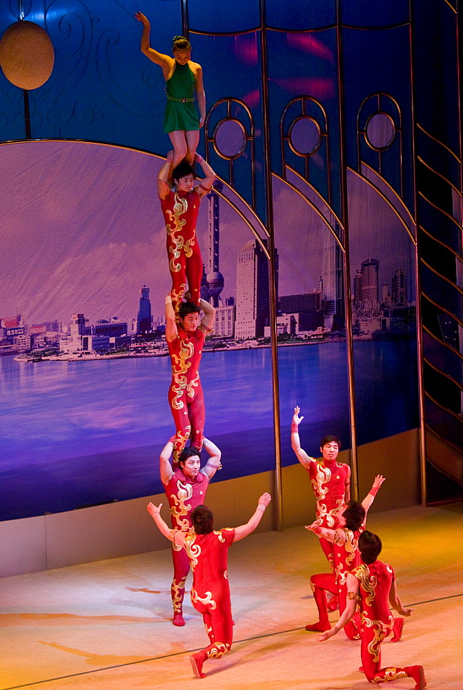 Members of the Shanghai Acrobatic Group performing on stage at the Shanghai Centre Theatre, China