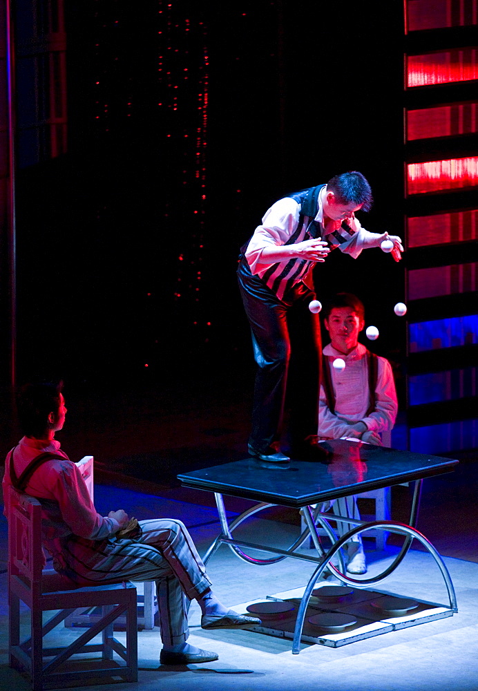 Members of the Shanghai Acrobatic Group performing on stage at the Shanghai Centre Theatre, China