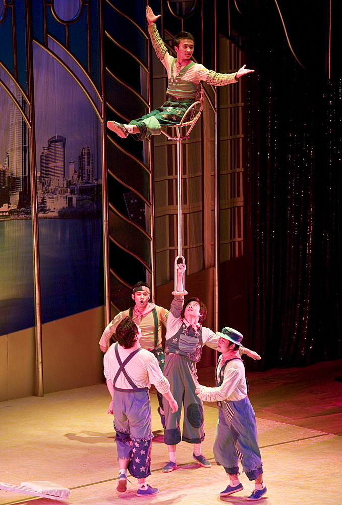 Members of the Shanghai Acrobatic Group performing on stage at the Shanghai Centre Theatre, China