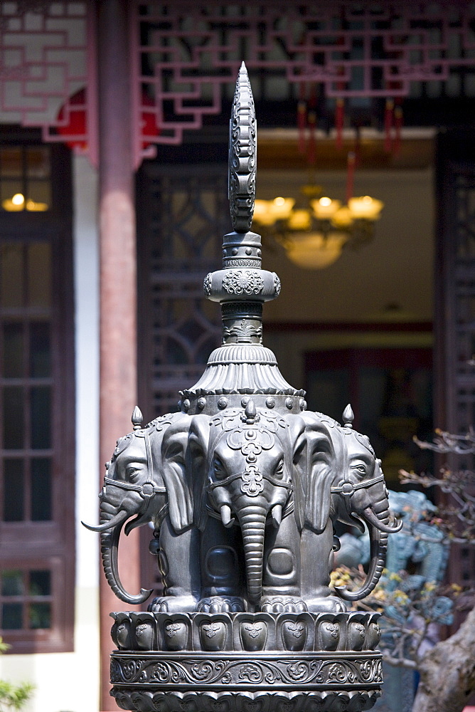 Bronze elephant-heads statue in the courtyard of the Jade Buddha Temple, Shanghai, China