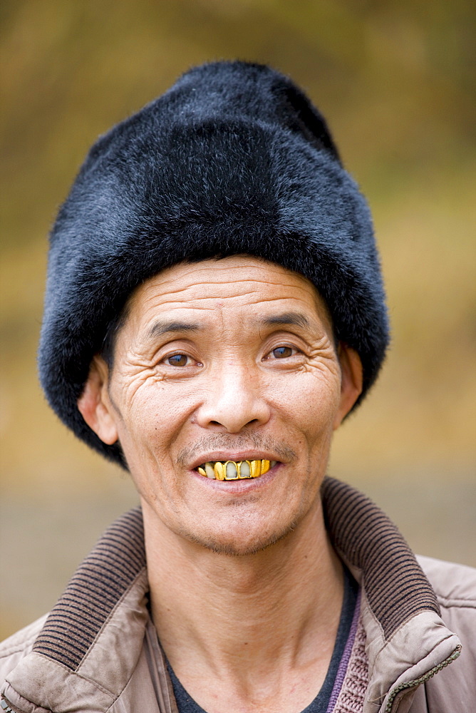 Chinese man wearing fur hat in Guilin, China