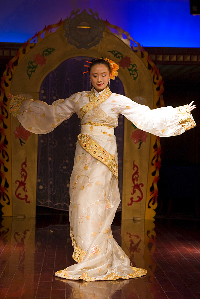 Dancer performing traditional show on Victoria Line Cruise Ship for Western tourists, Yangtze River, China