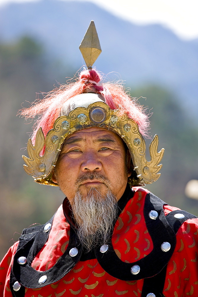 Man dressed in Mongolian Warrior costume at The Great Wall of China, Mutianyu, north of Beijing