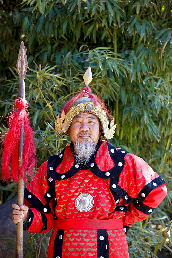 Man dressed in Mongolian Warrior costume at The Great Wall of China, Mutianyu, north of Beijing