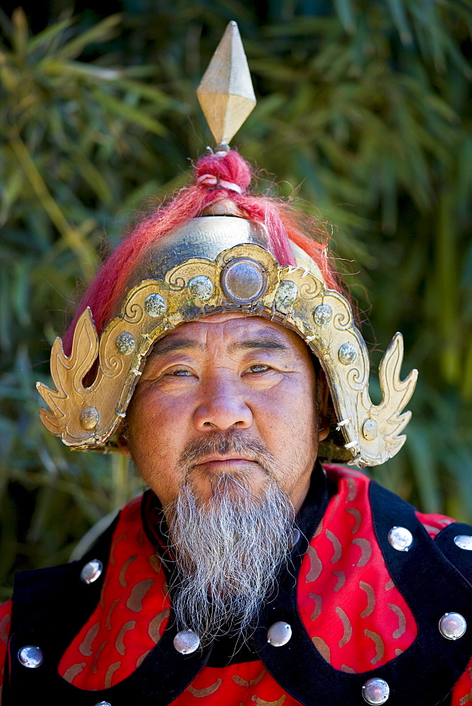 Man dressed in Mongolian Warrior costume at The Great Wall of China, Mutianyu, north of Beijing