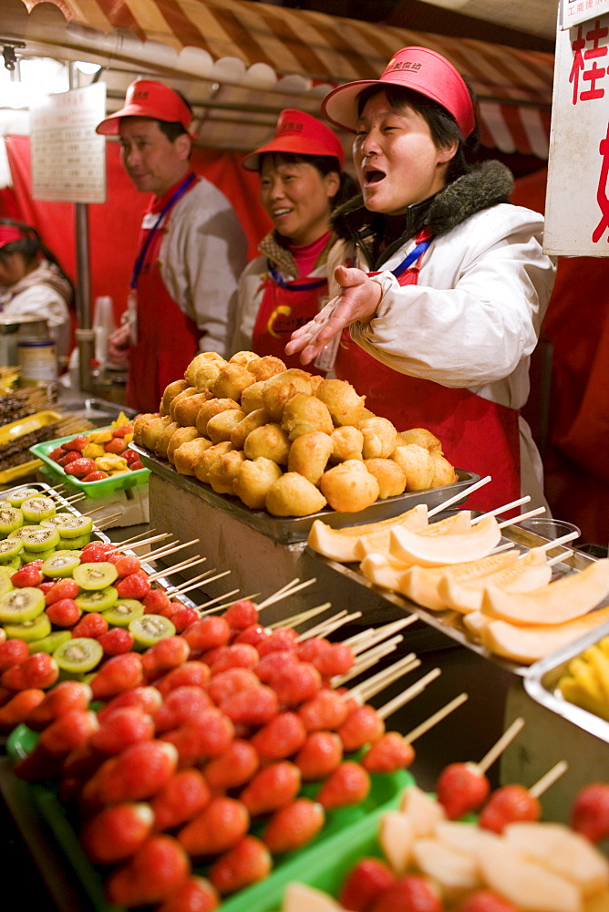 Stall selling candied fruit sticks in the Night Market, Wangfujing Street, Beijing, China