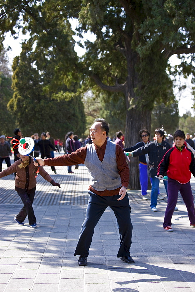 Tai chi with bat and ball in park of the Temple of Heaven, Beijing, China