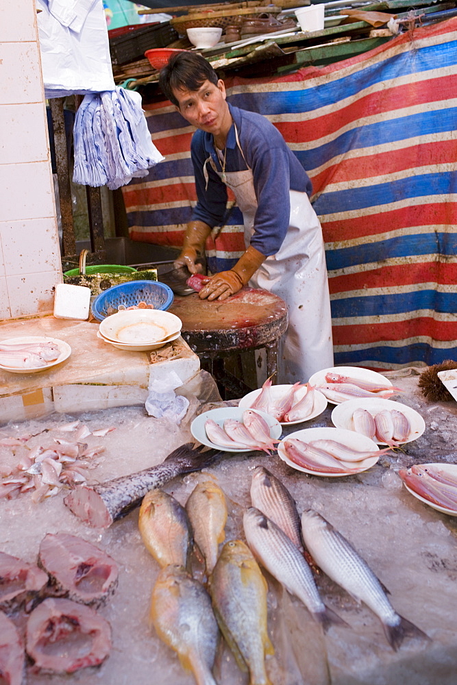 Fresh fish on sale in traditional old Chinese Soho food market in Graham Street, Central Hong Kong, China