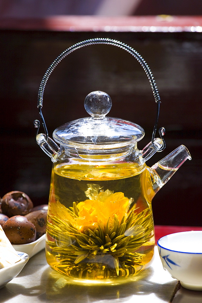 Flower infused tea and traditional snacks in the Huxinting Teahouse, Yu Garden Bazaar Market, Shanghai, China