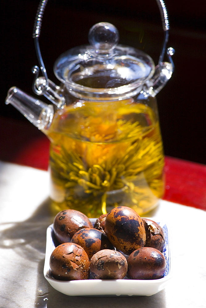 Flower infused tea and quails eggs in the Huxinting Teahouse, Yu Garden Bazaar Market, Shanghai, China