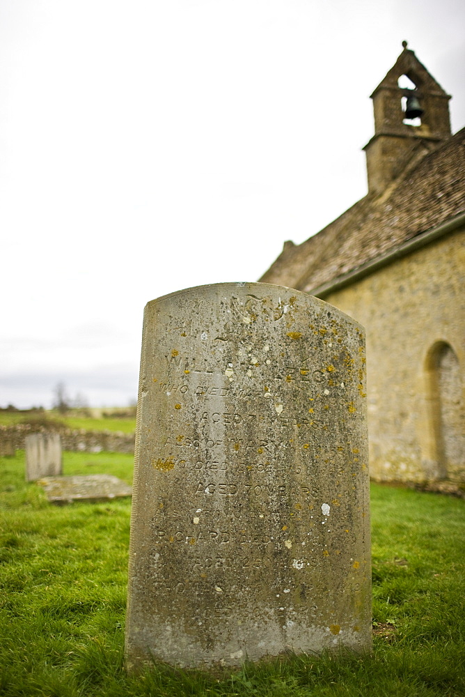 Gravestone at St Oswalds Church, Widford, in the Cotswolds, Oxfordshire, UK