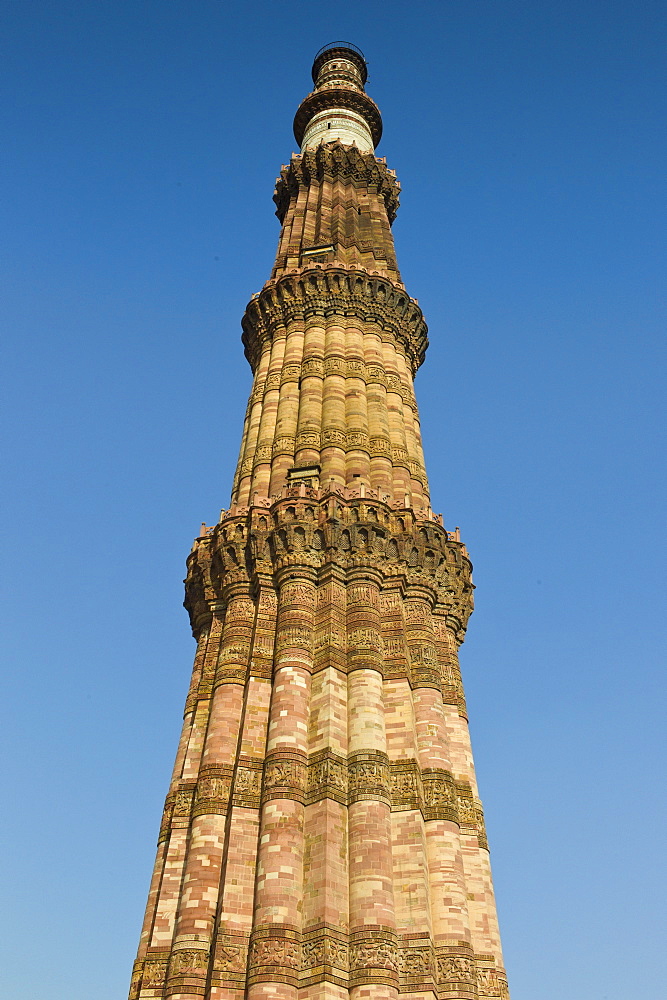 Qutub Minar minaret tower with verses from the Qur'an at Qutab Minar Complex, Unesco World Heritage Site in New Delhi, India