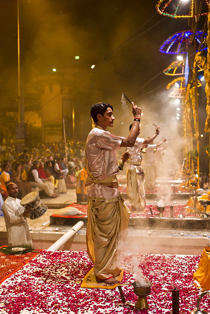 Hindu priests at sundown Aarti Ritual Ceremony of Light during Shivrati Festival in Holy City of Varanasi, Benares, India