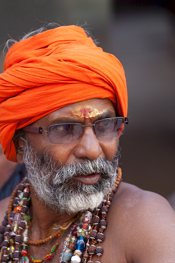 Hindu sadhu pilgrim with beads and turban in holy city of Varanasi, Benares, India