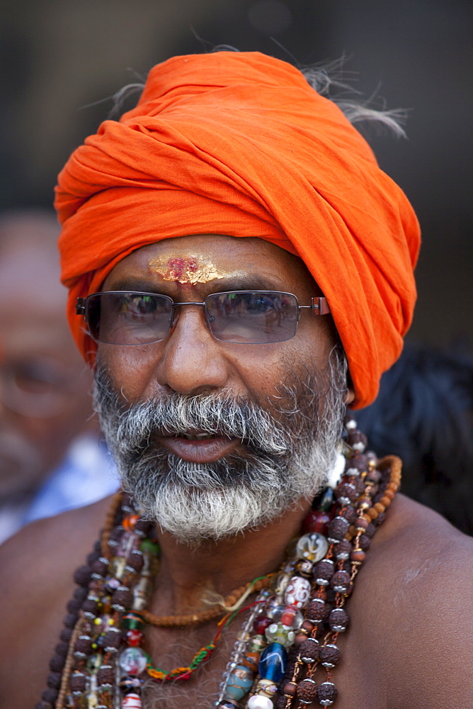 Hindu sadhu pilgrim with beads and turban in holy city of Varanasi, Benares, India