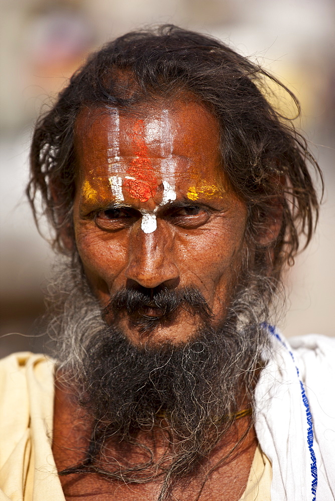 Hindu Sadhu holy man with traditional markings in street in Nandi near Varanasi, Benares, Northern India