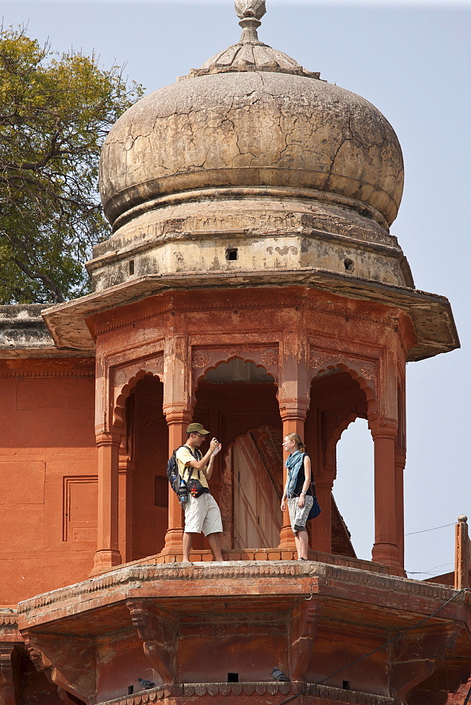 Tourists at Maharaja Chet Singh Palace Fort at Chet Singh Ghat by The Ganges River in holy city of Varanasi, Northern India