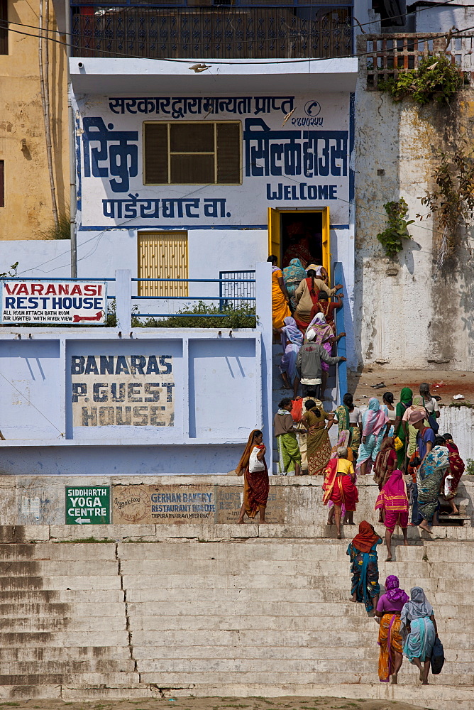 Indian women queue for silk shop near Chet Singh Ghat on banks of The Ganges River in holy city of Varanasi, Northern India