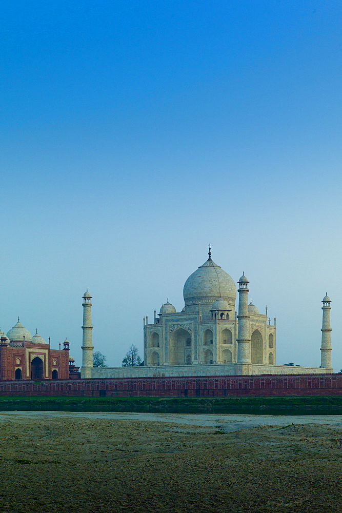 The Taj Mahal North Side viewed across Yamuna River at sunset , India