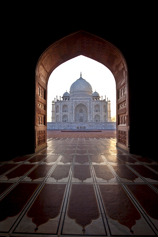 The Taj Mahal mausoleum western view (viewed from Taj Mahal Mosque with its prayer mat floor tiles) at dawn, Uttar Pradesh, India