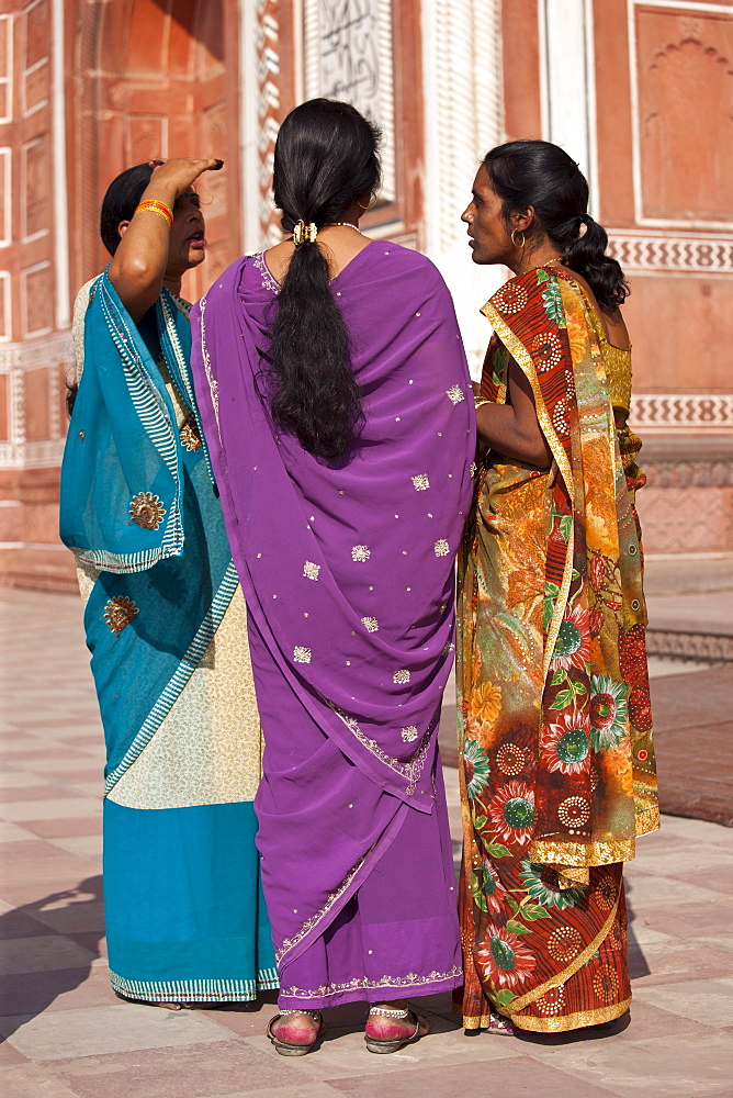 Indian women at South Gate of The Taj Mahal, Darwaza-i rauza in Uttar Pradesh, India