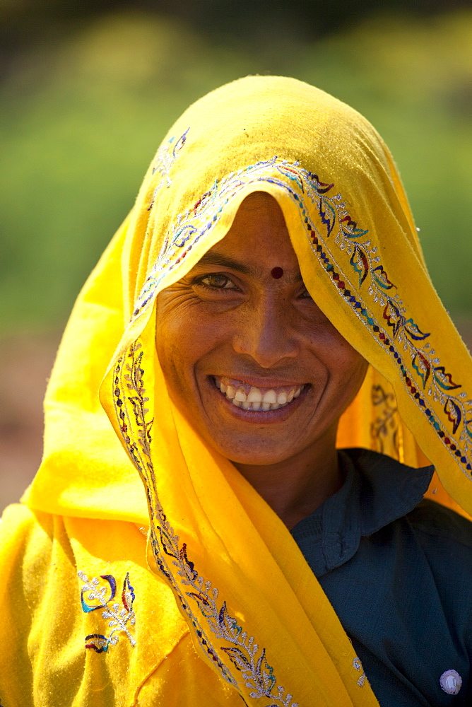 Indian woman villager at farm smallholding at Sawai Madhopur near Ranthambore in Rajasthan, Northern India