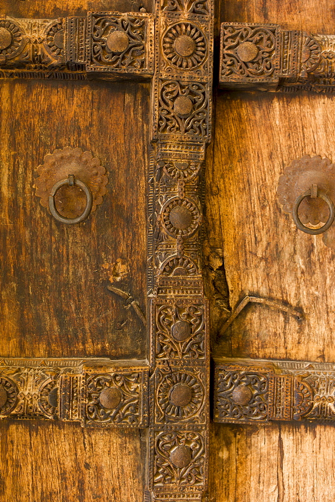 Hindu style traditional door in Acacia wood at the 16th Century Amber Fort in Jaipur in Rajasthan, Northern India