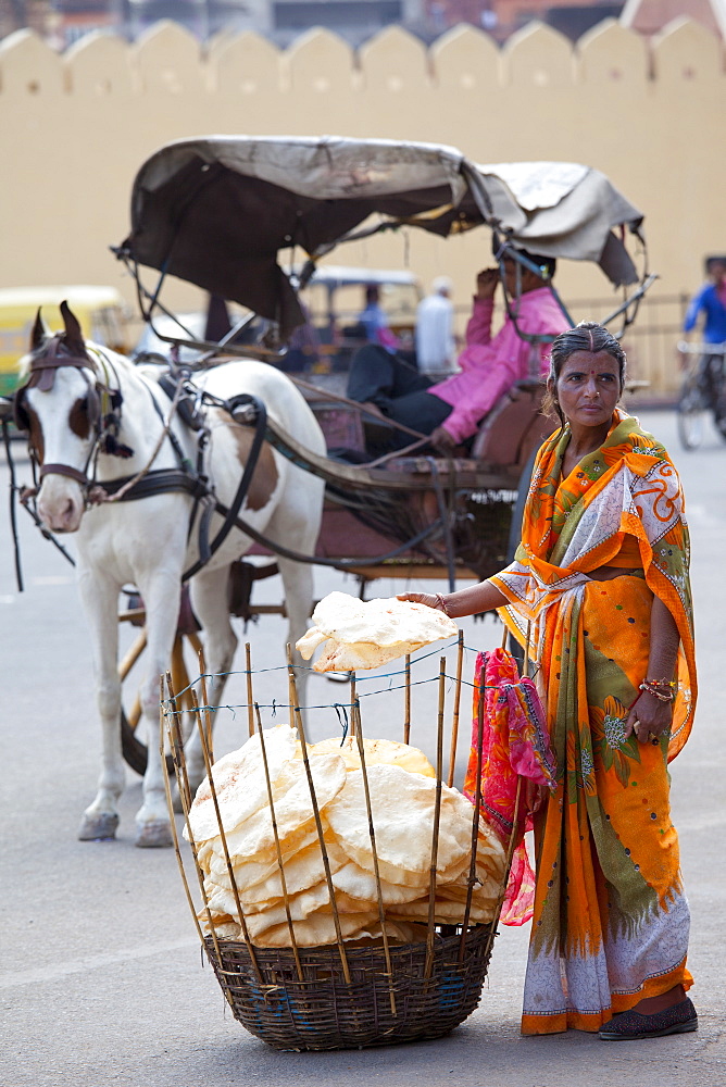 Indian woman selling poppadoms by The Observatory in Jaipur, Rajasthan, India