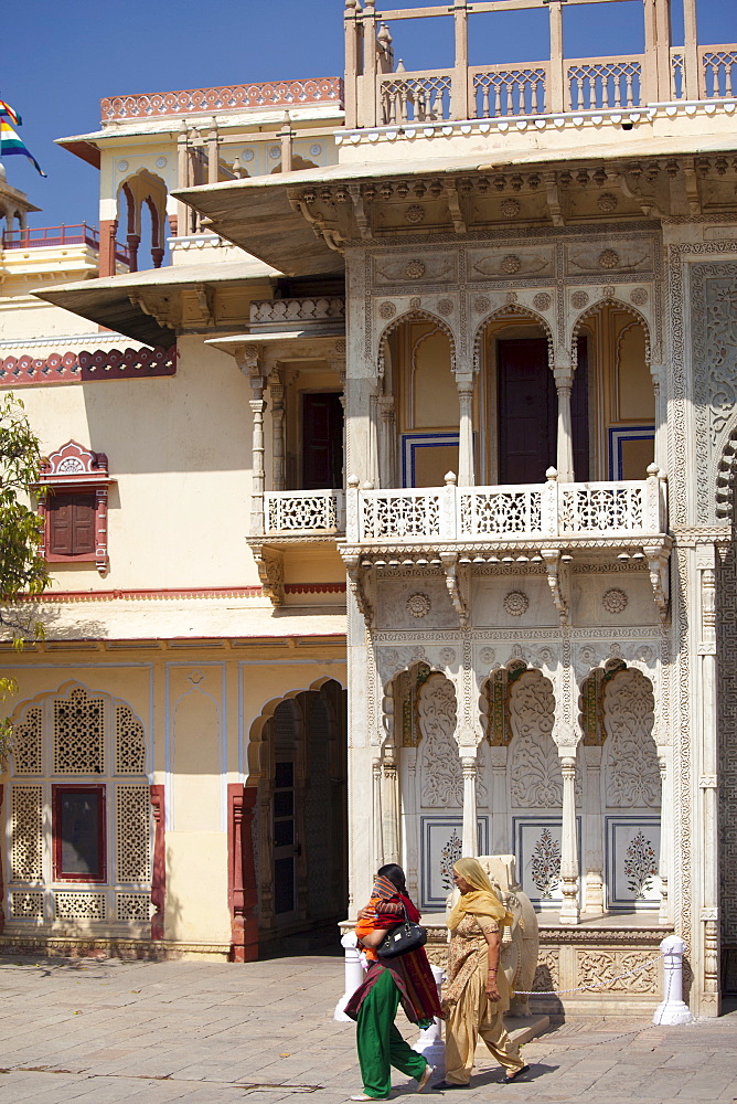 Tourists at The Maharaja of Jaipur's Moon Palace with flags to show that Maharaja is in residence in Jaipur, Rajasthan, India